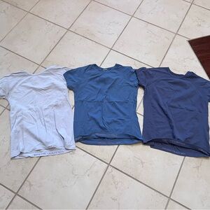 Set of Three Athleta girl T-Shirts in lavendar, Blue, and Navy